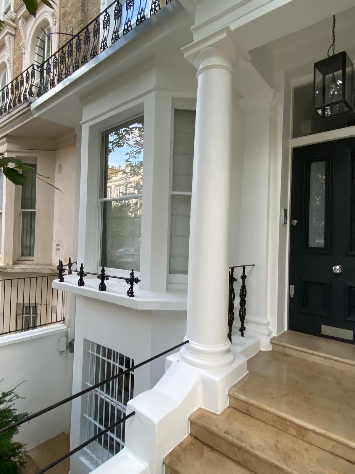 Front bay, portico column and crisp stucco detailing on a London townhouse