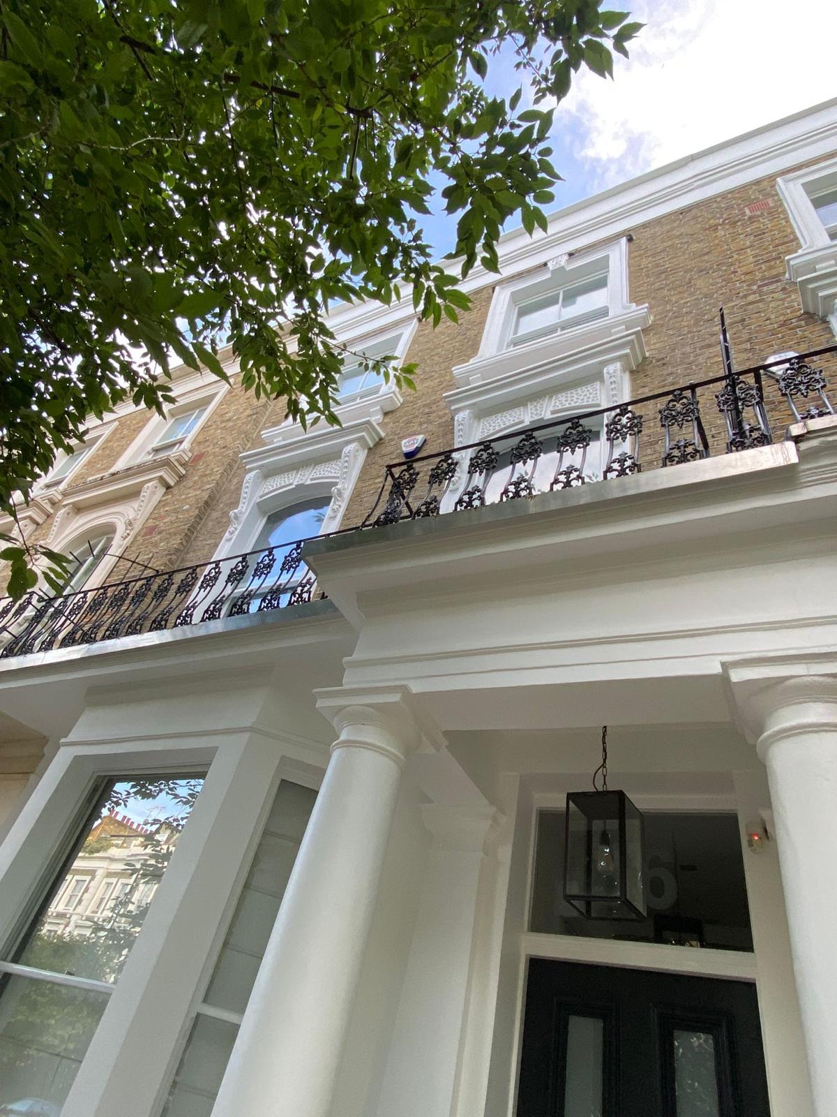 Refined London townhouse entrance with restored portico and facade detailing