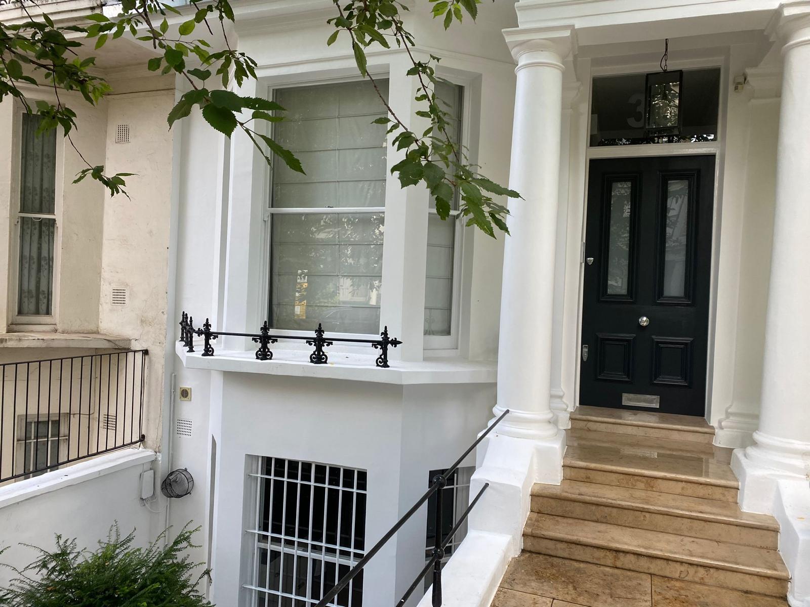 Elegant portico entrance and front steps on a restored London townhouse