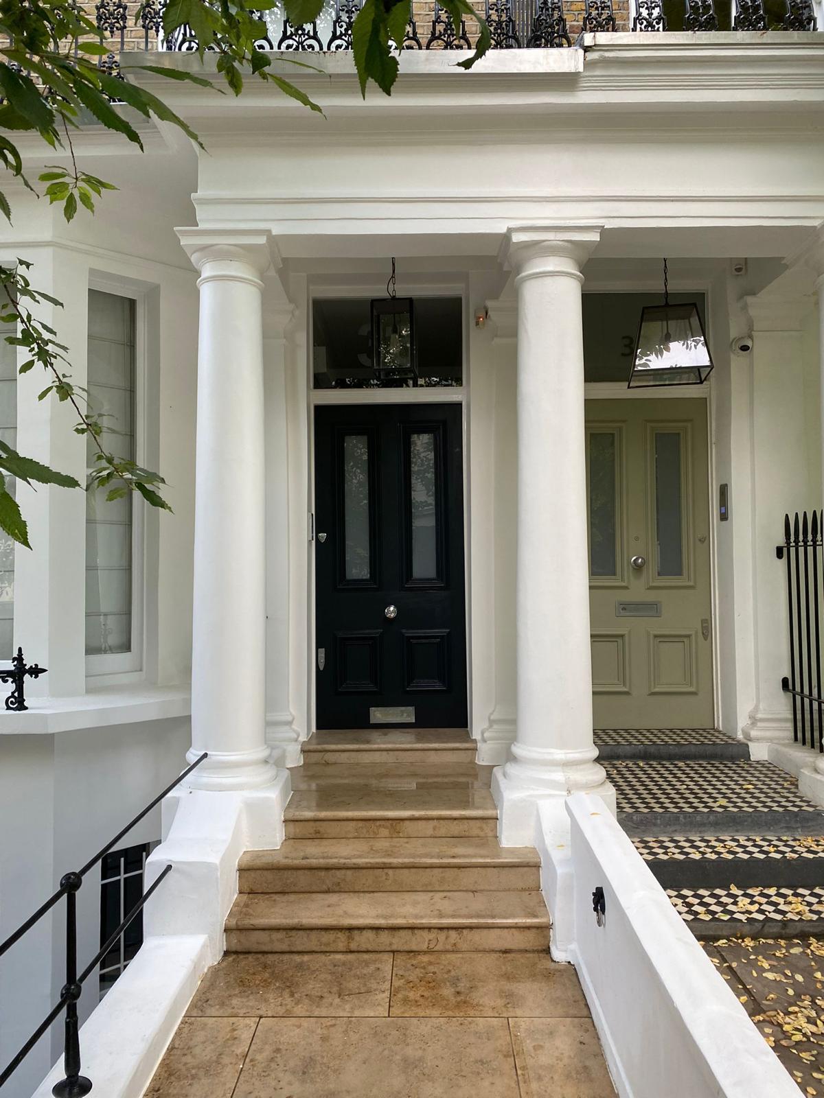 Stone entrance steps and restored portico on a London townhouse