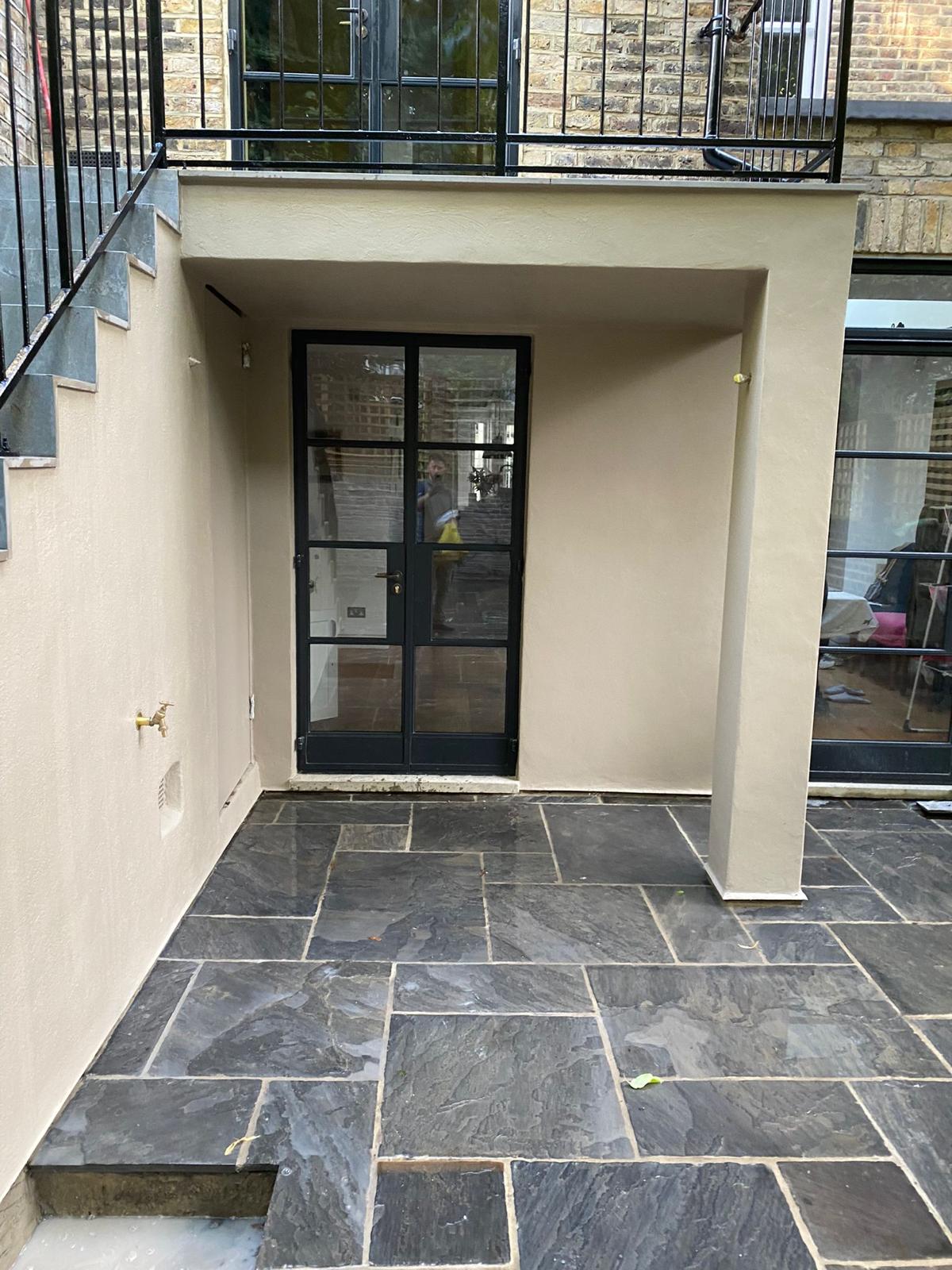 Application of breathable masonry paint to a restored exterior